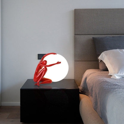 Humanoid Ball Holding Table Lamp