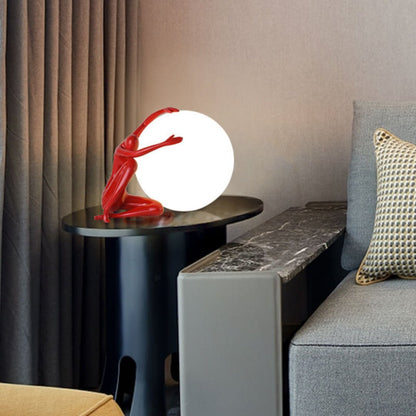 Humanoid Ball Holding Table Lamp