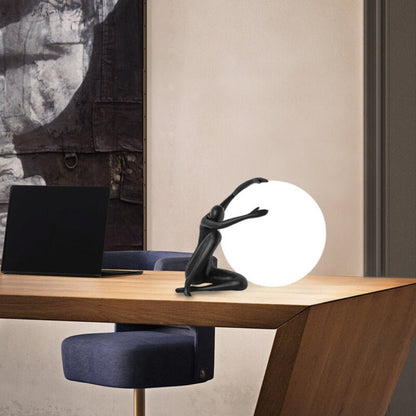 Humanoid Ball Holding Table Lamp